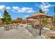 Entertainer's patio with gazebo, fire pit, and ample seating, ideal for gatherings at 9180 Mohawk St, Las Vegas, NV 89139