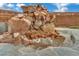 Stunning rock water feature creates a peaceful backyard oasis with its soothing sounds at 9180 Mohawk St, Las Vegas, NV 89139