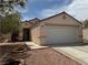 Charming single-story home with a two-car garage, desert landscaping, and a well-maintained stucco exterior at 9611 Sky Hollow Dr, Las Vegas, NV 89123