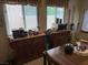 Bright kitchen area with wooden cabinets, tiled floor, and plenty of counter space for meal preparation at 9611 Sky Hollow Dr, Las Vegas, NV 89123
