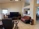 Bright living room featuring neutral walls, tile floors, and comfortable seating area at 9611 Sky Hollow Dr, Las Vegas, NV 89123