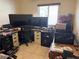 Dedicated office space with multiple desks, monitors, and ample storage options at 9611 Sky Hollow Dr, Las Vegas, NV 89123