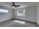 Bedroom with carpet floors, white walls, ceiling fan and good natural light at 9855 Ashton Pines Ct, Las Vegas, NV 89147