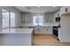 Modern kitchen with white cabinets, quartz countertops, subway tile backsplash, and stainless steel appliances at 9855 Ashton Pines Ct, Las Vegas, NV 89147