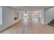 Spacious living room with a modern fireplace, large windows, and sliding glass doors to the backyard at 9855 Ashton Pines Ct, Las Vegas, NV 89147