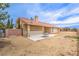 A spacious backyard with gravel cover featuring a covered patio and privacy fence at , Pahrump, NV 89061