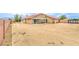 Backyard features gravel cover, a covered patio, and a privacy fence at , Pahrump, NV 89061
