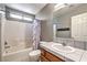 Traditional bathroom with a shower-tub combo, single sink vanity, and neutral tile at , Pahrump, NV 89061