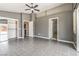 Spacious primary bedroom featuring tile floors, a ceiling fan, and ensuite bathroom access at , Pahrump, NV 89061