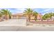 Charming single story home with three-car garage, desert landscaping, and appealing curb appeal at , Pahrump, NV 89061
