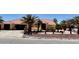 Charming single-story home with a fountain, palm trees, and a tile roof at , Pahrump, NV 89061