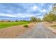 Community green space with walking path, lush grass, mature trees, and mountain views at , Pahrump, NV 89061