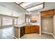 Well-lit kitchen with a breakfast bar that opens to living room and dining area at , Pahrump, NV 89061
