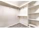 Spacious walk-in closet with ample shelving and hanging space with tile flooring at , Pahrump, NV 89061
