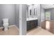Bathroom with a toilet and vanity with view to a living space at 10211 Red Pueblo Pl # 203, Las Vegas, NV 89144