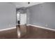 This bedroom features neutral walls and wood floors at 10211 Red Pueblo Pl # 203, Las Vegas, NV 89144
