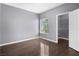 Bedroom with hardwood floors, closet, and natural light coming through the window at 10211 Red Pueblo Pl # 203, Las Vegas, NV 89144