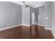 This bedroom features neutral walls and wood floors at 10211 Red Pueblo Pl # 203, Las Vegas, NV 89144