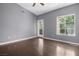 This bedroom features neutral walls and wood floors at 10211 Red Pueblo Pl # 203, Las Vegas, NV 89144