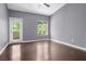 This bedroom features neutral walls and wood floors at 10211 Red Pueblo Pl # 203, Las Vegas, NV 89144
