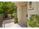 Front door with security screen and greenery and address plaque at 10211 Red Pueblo Pl # 203, Las Vegas, NV 89144