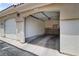 One car garage with garage door open at 10211 Red Pueblo Pl # 203, Las Vegas, NV 89144