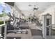 Community gym featuring treadmills, elliptical machines, and weight-training equipment, all well-lit by natural light at 10211 Red Pueblo Pl # 203, Las Vegas, NV 89144