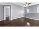 Bright and airy living room with hardwood floors and neutral walls, leading to additional rooms at 10211 Red Pueblo Pl # 203, Las Vegas, NV 89144