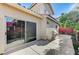 Back patio with sliding glass door, grill, and outdoor kitchen setup at 10372 Timber Canyon Ave, Las Vegas, NV 89129