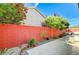 Charming backyard space with decorative rock garden, red brick wall, and paved area at 10372 Timber Canyon Ave, Las Vegas, NV 89129