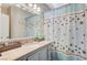 Full bathroom with vanity, bathtub, and shower featuring starfish themed curtain at 10372 Timber Canyon Ave, Las Vegas, NV 89129