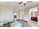 Spacious bedroom with modern laminate flooring and ensuite bathroom at 10372 Timber Canyon Ave, Las Vegas, NV 89129
