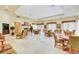 Spacious dining area with multiple tables and chairs, ideal for gatherings at 10372 Timber Canyon Ave, Las Vegas, NV 89129