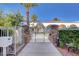 Gated community entrance with stone pillars, offering security and a welcoming ambiance at 10372 Timber Canyon Ave, Las Vegas, NV 89129