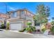 Charming home featuring low-maintenance landscaping, a tile roof, and an attached garage at 10372 Timber Canyon Ave, Las Vegas, NV 89129