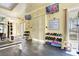 Bright community gym featuring various weights, machines, and wall-mounted television at 10372 Timber Canyon Ave, Las Vegas, NV 89129