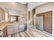 A bright kitchen features stainless steel appliances and seamless flow to the living areas at 10372 Timber Canyon Ave, Las Vegas, NV 89129