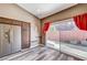 Kitchen area with stainless steel refrigerator and sliding door to backyard at 10372 Timber Canyon Ave, Las Vegas, NV 89129