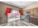 Cozy kitchen features stainless steel appliances, granite countertops and a sliding door to the backyard at 10372 Timber Canyon Ave, Las Vegas, NV 89129