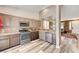Well-lit kitchen boasting stainless steel appliances and wood-style flooring at 10372 Timber Canyon Ave, Las Vegas, NV 89129