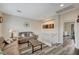 Upstairs loft with two sofas, wood-look floors, and lots of natural light at 10372 Timber Canyon Ave, Las Vegas, NV 89129