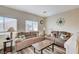 Cozy loft area featuring wood-look floors, two sofas, and plenty of seating at 10372 Timber Canyon Ave, Las Vegas, NV 89129