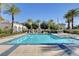 Beautiful pool area offers a refreshing retreat, surrounded by lush greenery and swaying palm trees at 10372 Timber Canyon Ave, Las Vegas, NV 89129