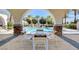 Charming pool area, perfect for lounging and entertaining, is framed by stately archways and beautiful landscaping at 10372 Timber Canyon Ave, Las Vegas, NV 89129