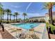 Well-maintained pool area, ideal for relaxation and socializing, is enhanced by lush landscaping and shade at 10372 Timber Canyon Ave, Las Vegas, NV 89129