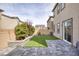This beautiful backyard has artificial turf, hardscape, and desert landscaping at 10376 Sadie Blake Ave, Las Vegas, NV 89166