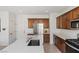 The kitchen features stainless appliances, sleek countertops, and ample storage at 10376 Sadie Blake Ave, Las Vegas, NV 89166