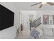 Modern bright living room with tile floors, ceiling fan and open entry at 10376 Sadie Blake Ave, Las Vegas, NV 89166