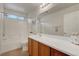 Well-lit bathroom featuring vanity, framed mirror and a tub with shower at 10929 Vallerosa St, Las Vegas, NV 89141