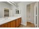 Bathroom with double sinks, wood vanity and separate tub and shower at 10929 Vallerosa St, Las Vegas, NV 89141